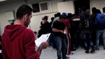 Migranter registrerar sig på grekiska Lesbos som en del av EU:s nuvarande asylsystem. Arkivbild.